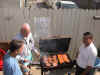 Mike Morris, Bill Armstrong, and Dan Medina busy cooking and sharing