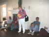 Sylvia Paoli (Orange County District Councillor) is giving Dwight Smith donations raised by the fraternities for use by the Catholic Worker.
