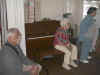 Fraternity members listening to Dwight Smith explain the needs at Isaiah House