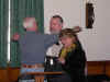 Rock presenting bags to Carol and Fr. Michael